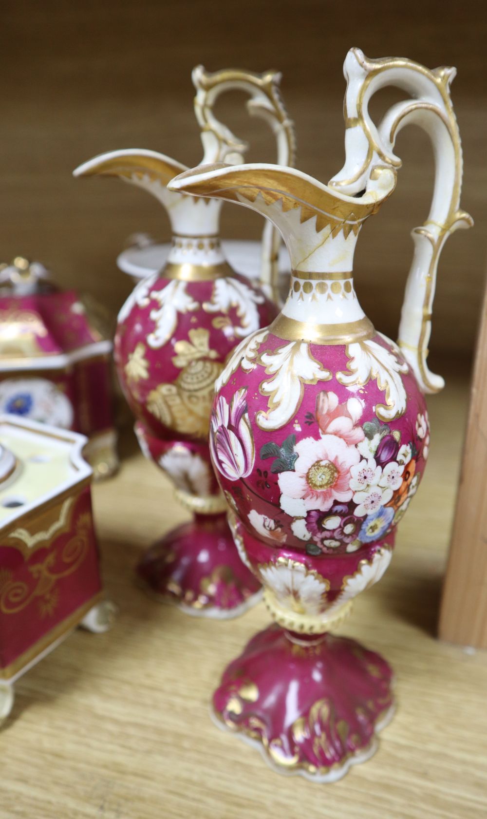 A group of English porcelain ruby ground vessels, c. 1825-45,